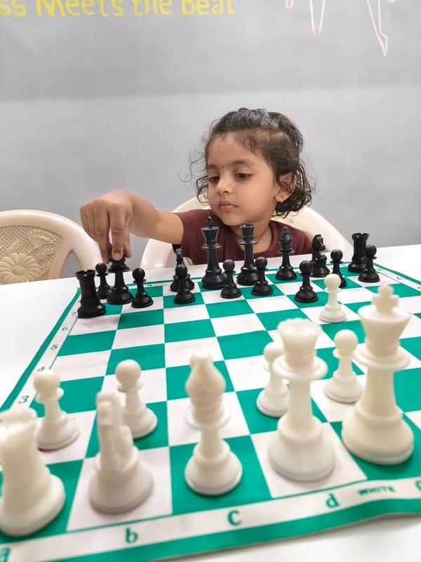 Girl playing chess at Fitbeat Studio Bhandup