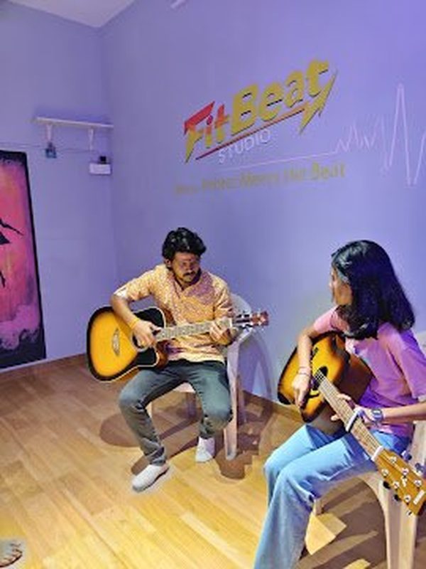 Guitar instructor and student at Fitbeat Studio Bhandup Nahur East